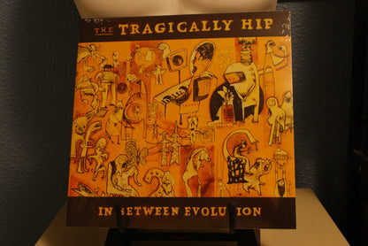 The Tragically Hip : In Between Evolution (LP, Album)